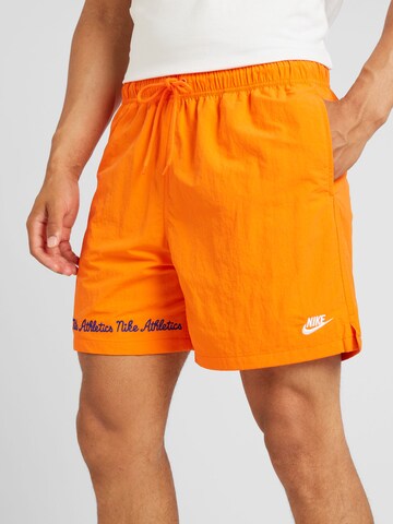 Nike Sportswear Regular Trousers 'CLUB' in Orange