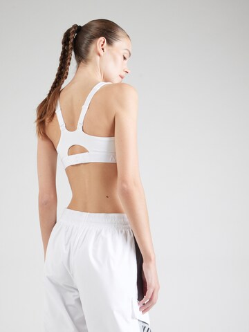 Bustino Reggiseno sportivo 'INDY' di NIKE in bianco