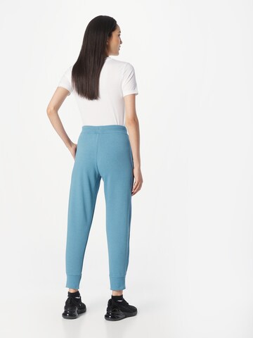 Effilé Pantalon de sport NIKE en bleu