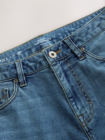 Coupe slim Jean 'Motion Flex' Next en bleu