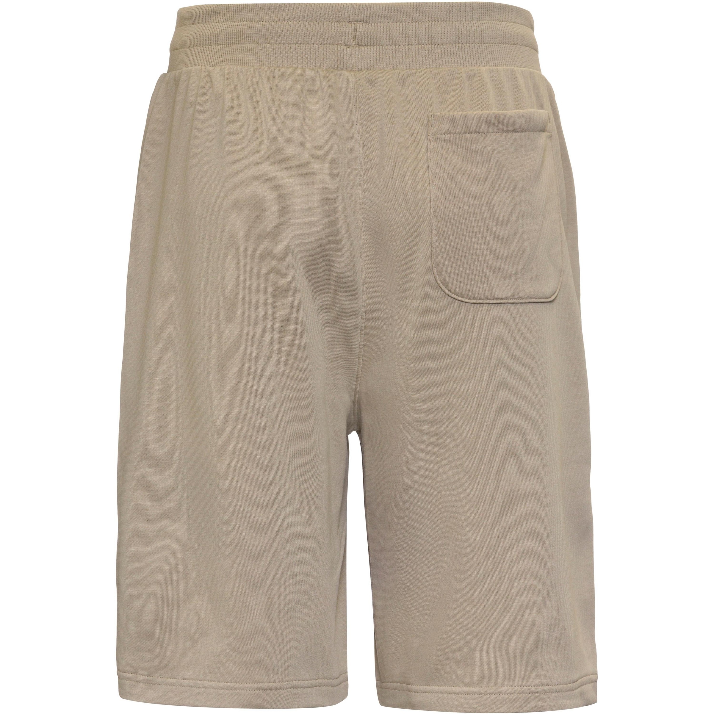 UNDER ARMOUR Loose fit Sports trousers 'Rival' in Brown