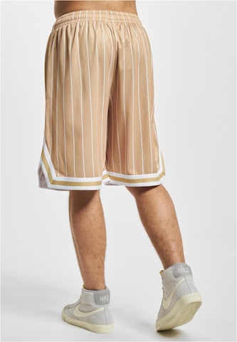 Loosefit Pantaloni di Karl Kani in beige