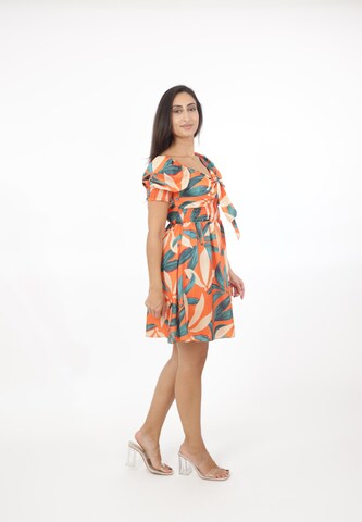 Elara Kjole i orange