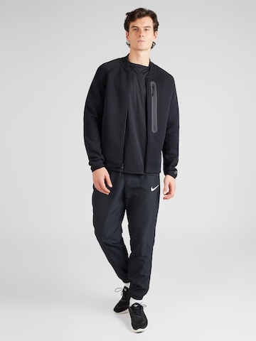 Veste de survêtement 'TCH FLC N98' Nike Sportswear en noir