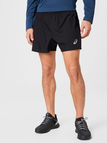 Regular Pantalon de sport ASICS en noir : devant