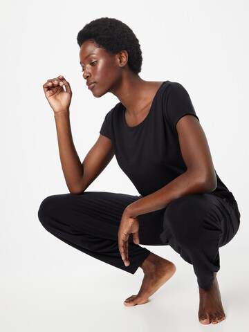 CURARE Yogawear Funkcionalna majica | črna barva