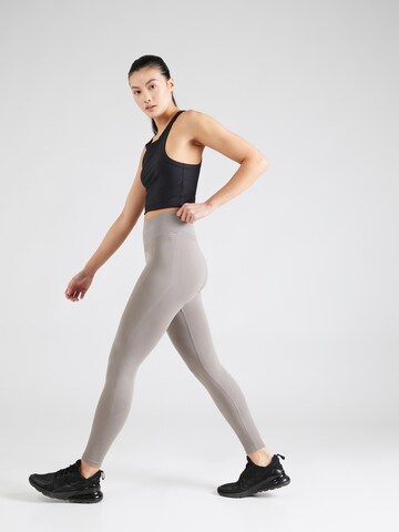 UNDER ARMOUR Skinny Spodnie sportowe w kolorze szary