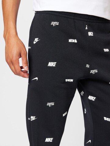 melns Nike Sportswear Pakapēniski sašaurināts piegriezums Bikses