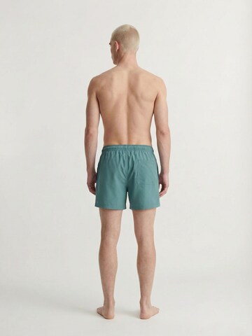 JACK & JONES Plavecké šortky 'JPSTMaui Tropic' – zelená