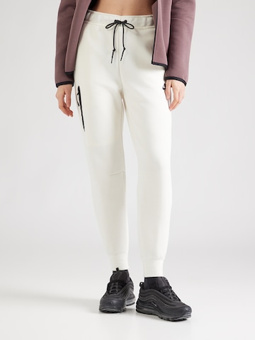 Nike Sportswear Tapered Trousers 'TCH FLC' in Beige: front