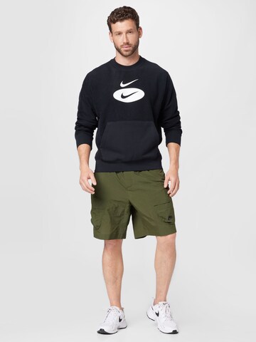 zaļš Nike Sportswear Vaļīgs piegriezums Kargo bikses