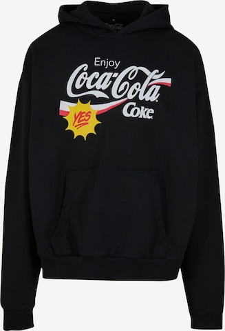 MerchcodeSweater majica 'Coca Cola Refreshed' - crna boja: prednji dio