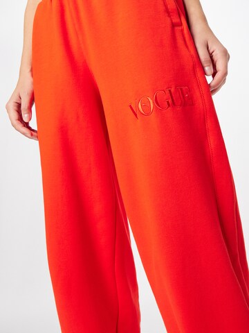 PUMA Tapered Broek in Oranje