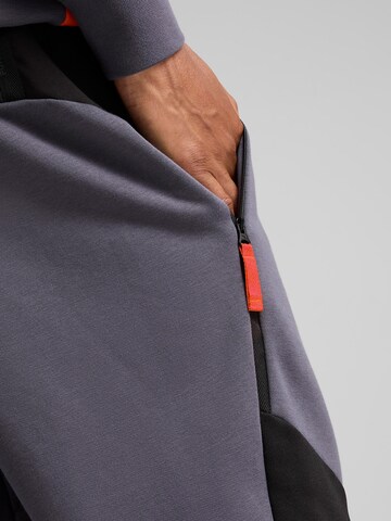 PUMA Tapered Sports trousers in Grey