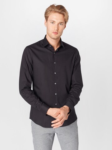 Coupe slim Chemise business Calvin Klein en noir : devant