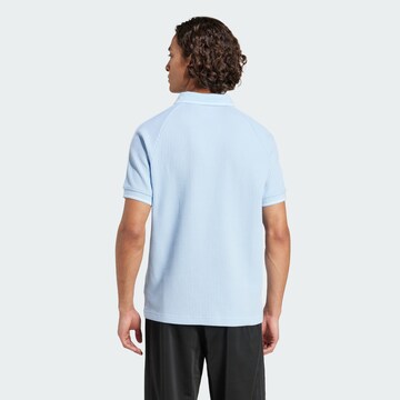 ADIDAS ORIGINALS T-shirt i blå