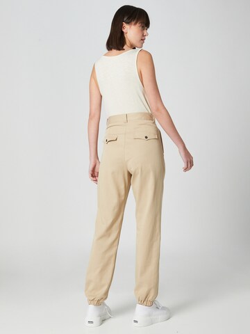 Guido Maria Kretschmer Women Tapered Pleat-front trousers 'Nicola' in Beige