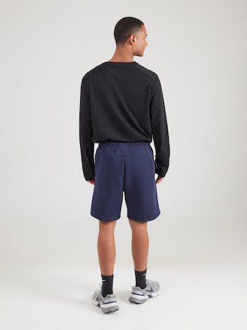 Nike SportswearLoosefit Hlače 'TECH FLC' - plava boja