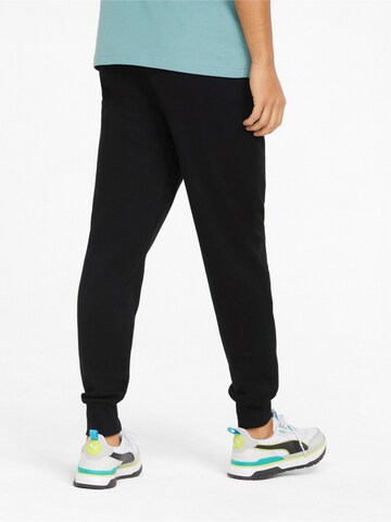 PUMA Tapered Sporthose 'ESS+' in Schwarz