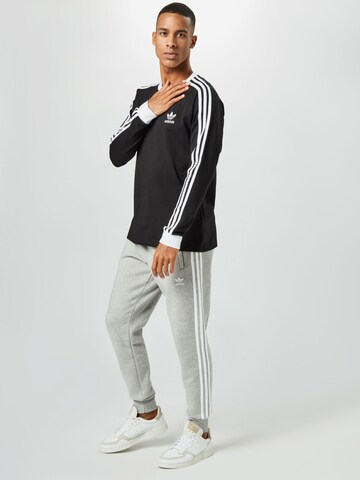 ADIDAS ORIGINALS Конический (Tapered) Штаны 'Adicolor Classics 3-Stripes' в Серый