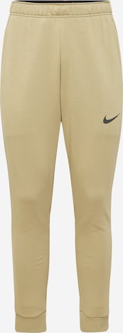 NIKE Workout Pants in Beige: front