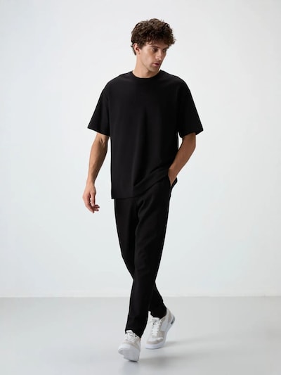 Tuta da jogging in L Tommy Life di colore nero, Visualizzazione prodotti