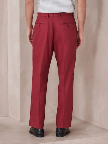 Loosefit Pantaloni con piega frontale di Next in rosso