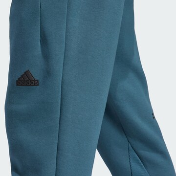 ADIDAS SPORTSWEAR Tapered Sportbroek 'Z.N.E. Premium' in Blauw