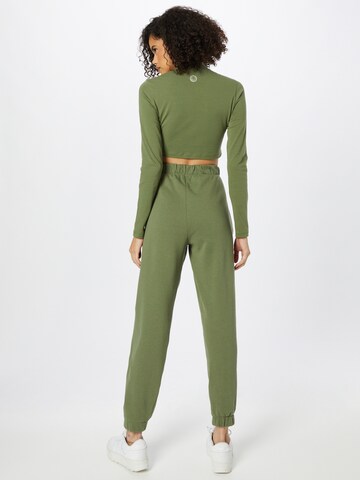ABOUT YOU x INNA Tapered Pants 'Sandra' in Green