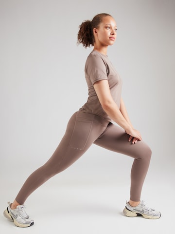 Skinny Pantalon de sport NIKE en marron