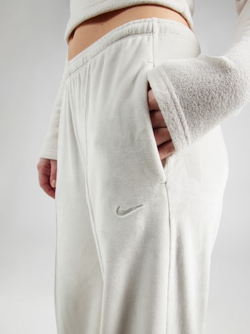 Nike Sportswear Lużny krój Spodnie w kolorze brązowy