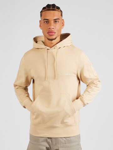 Sweat-shirt Calvin Klein Jeans en beige : devant