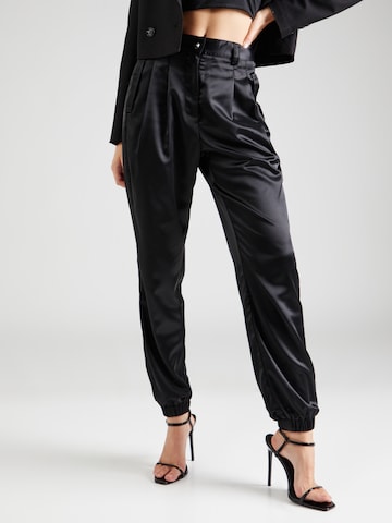 Guido Maria Kretschmer Women Tapered Pleat-Front Pants 'Nina' in Black: front