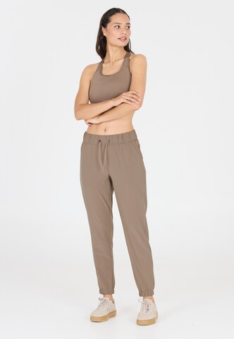 Athlecia Tapered Sportbroek 'Austberg' in Bruin