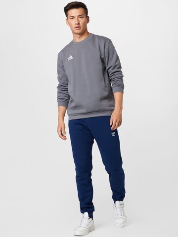 ADIDAS ORIGINALS Tapered Bukser 'Adicolor Essentials Trefoil' i blå