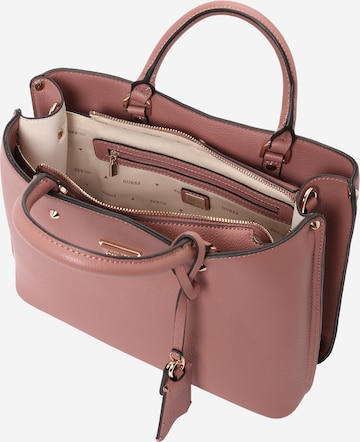 GUESS Käsilaukku 'Meridian' värissä vaaleanpunainen