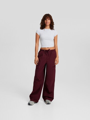 Bershka Wide leg Cargo trousers in Red