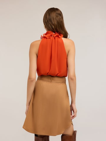 Top di MOTIVI in arancione