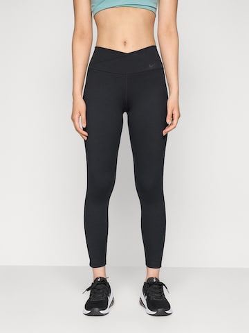 Skinny Pantaloni sport 'ONE' de la NIKE pe negru: față