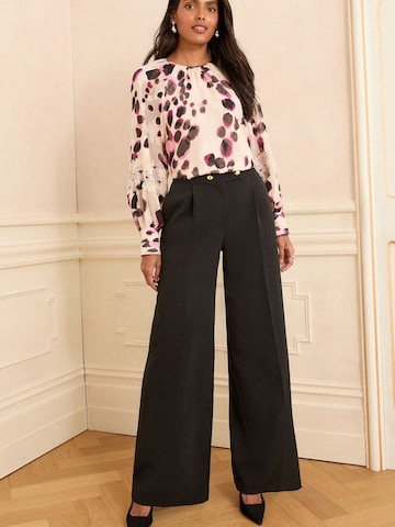 Wide leg Pantaloni con pieghe di love & roses in nero