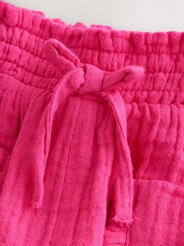 Next Zwężany krój Spodnie w kolorze różowy