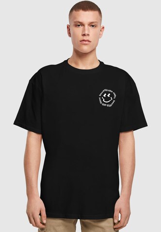 Merchcode T-Shirt 'Halloween - Haunted and Happy' in Schwarz: Vorderseite