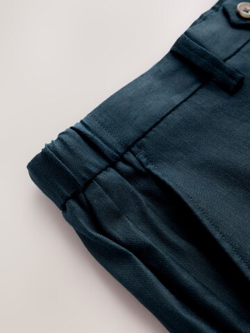 Next Slim fit Trousers with creases 'Motionflex' in Blue