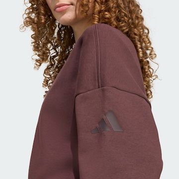 ADIDAS SPORTSWEAR - Sudadera con cremallera deportiva 'Essentials' en marrón