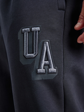 UNDER ARMOUR - Tapered Pantalón deportivo en negro
