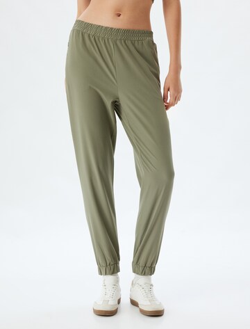 Koton Loose fit Trousers in Green: front