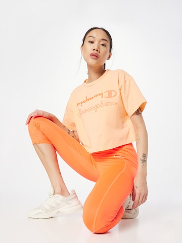 Champion Authentic Athletic Apparel Toiminnallinen paita värissä oranssi