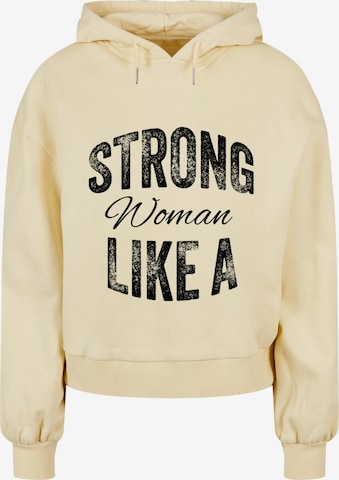 Merchcode Sweatshirt 'WD - Strong Like A Woman' in Geel: voorkant