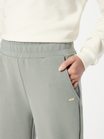 Athlecia Tapered Sporthose in Grün