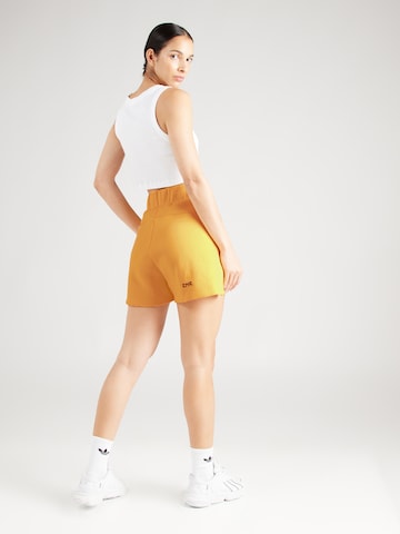 ADIDAS SPORTSWEAR Loose fit Workout Pants 'Z.N.E.' in Yellow